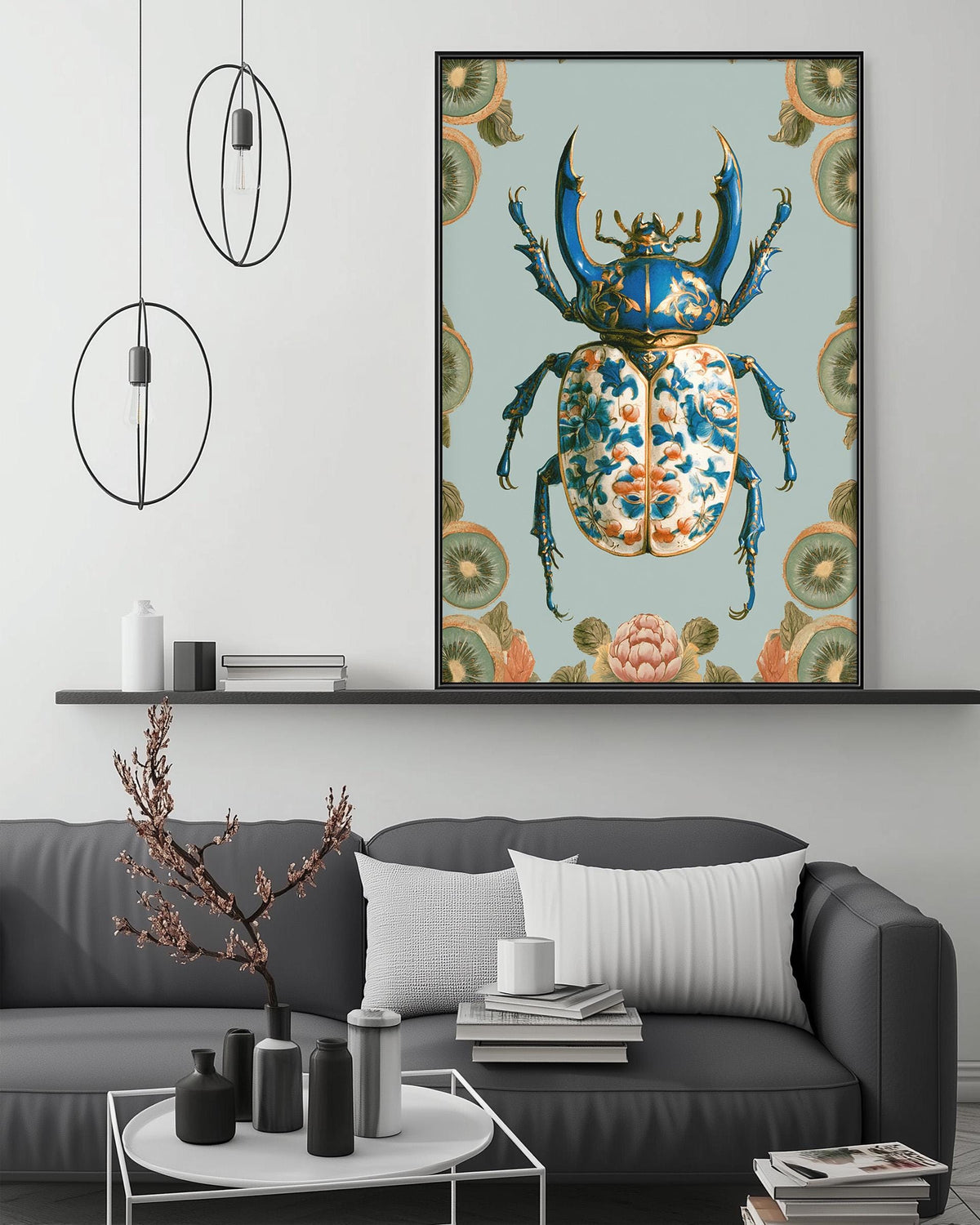 a large, colorful painting of a blue and gold beetle displayed on a wall above a gray couch in a living room setting.