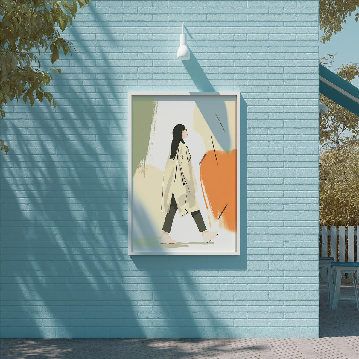 a framed illustration of a woman walking on a brick wall, with a tree and a building visible in the background.
