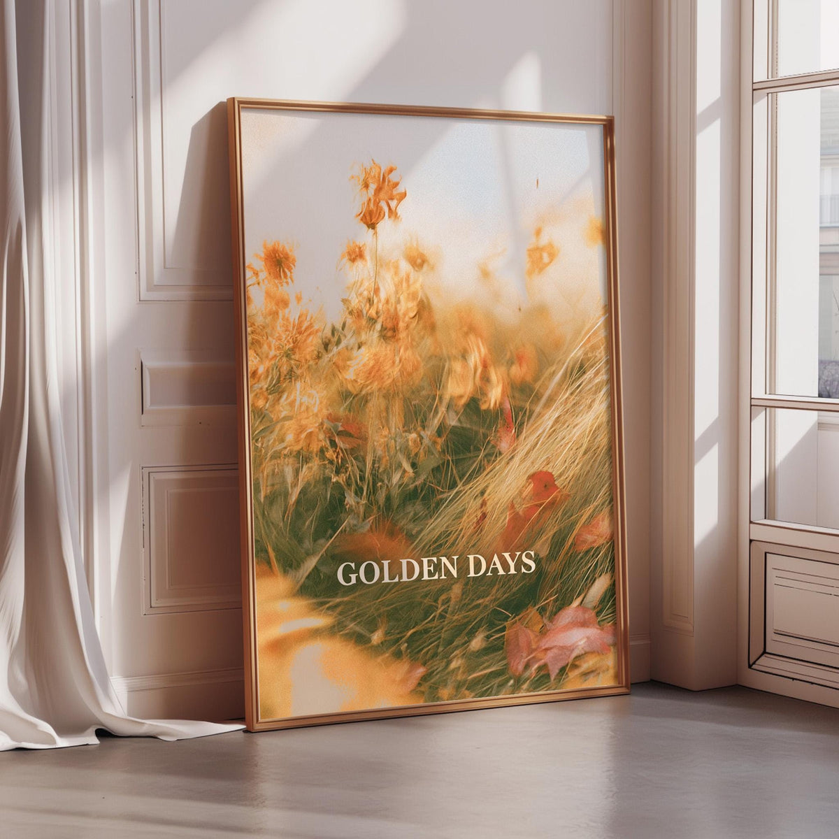 A framed photograph of a field of flowers with the text "GOLDEN DAYS" displayed on the bottom of the frame.