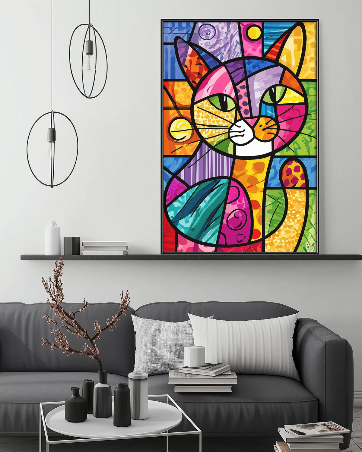 a vibrant, abstract painting of a cat in a colorful, geometric style, hanging on a wall above a gray couch in a living room setting.