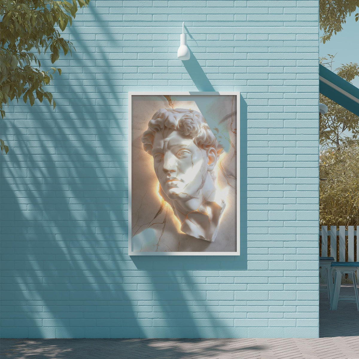 a large white sculpture of a man's head mounted on a blue brick wall.