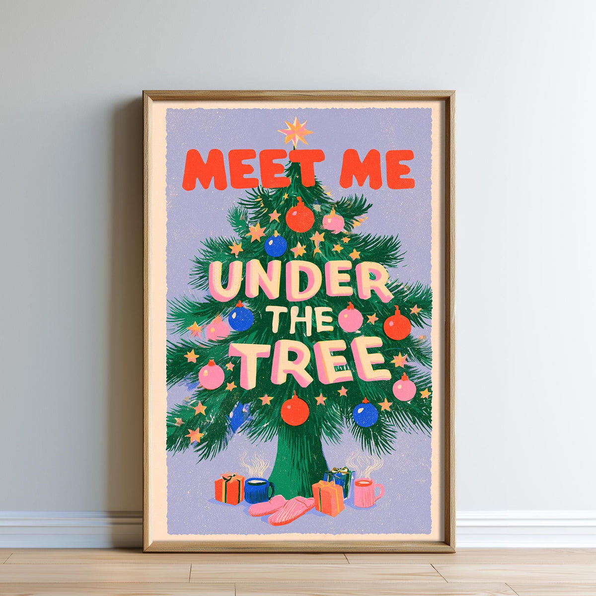 The image is a framed poster with a Christmas tree and various ornaments, along with the text "MEET ME UNDER THE TREE" written on it.