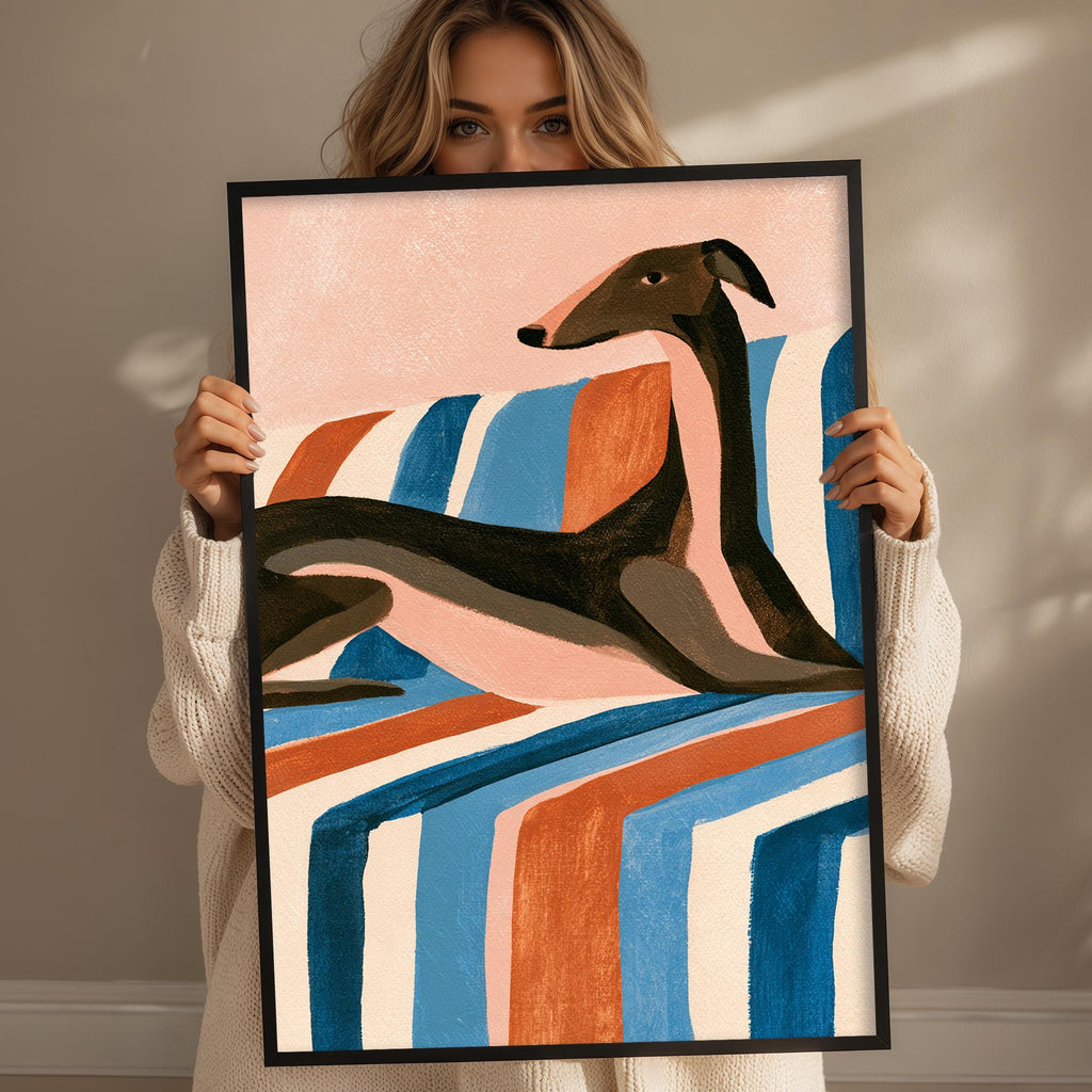 A woman is holding up a framed painting of a dog, which features a colorful abstract design with bold lines and shapes.