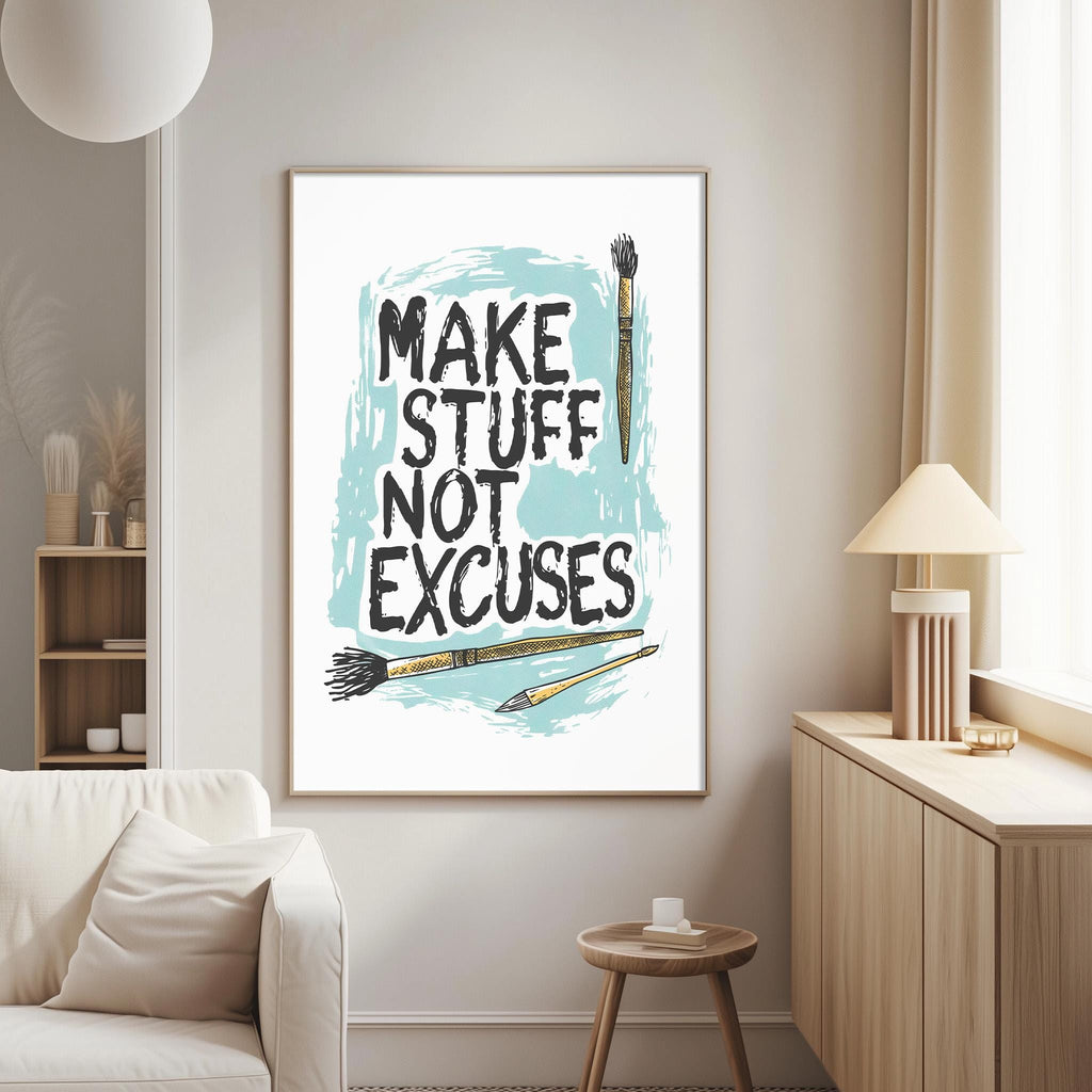 a living room with a framed poster on the wall that reads "MAKE STUFF NOT EXCUSES" along with illustrations of paintbrushes and a cup.