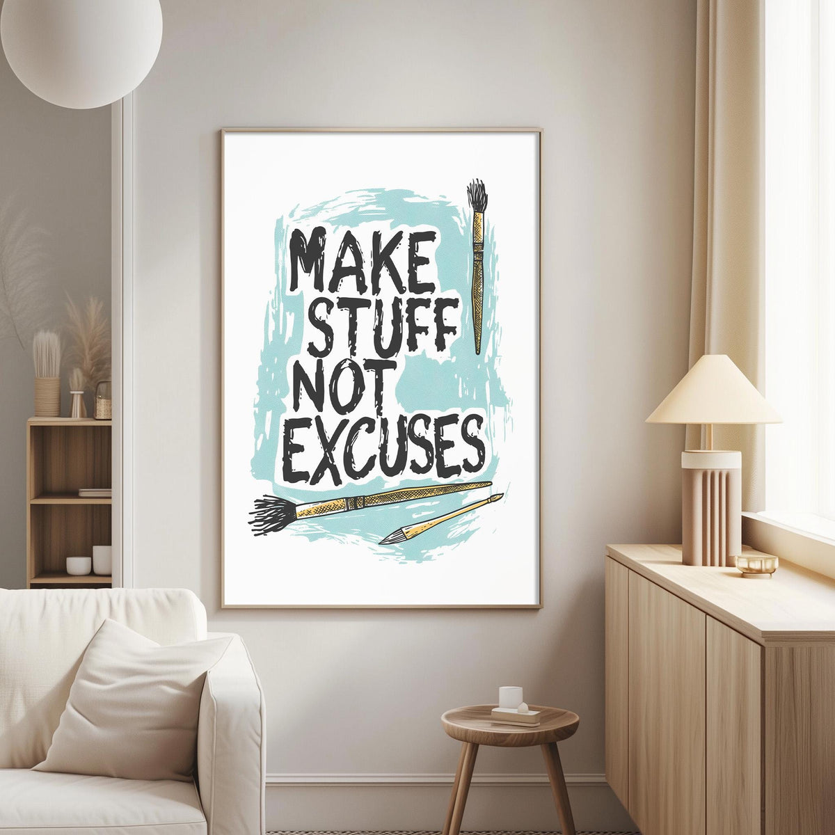 a living room with a framed poster on the wall that reads "MAKE STUFF NOT EXCUSES" along with illustrations of paintbrushes and a cup.