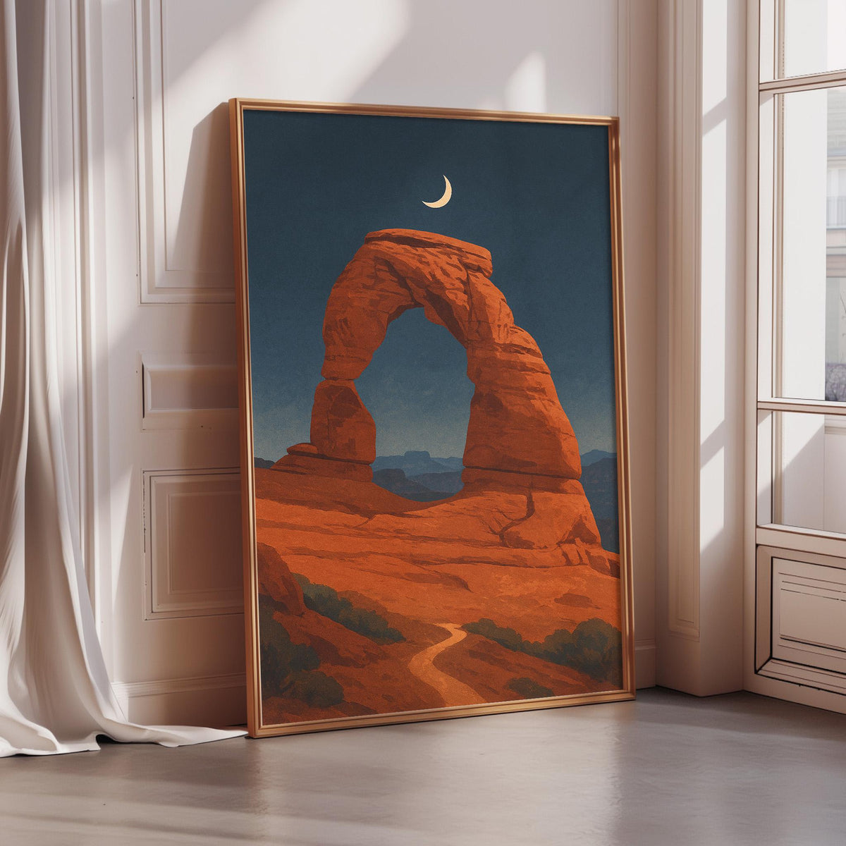 a large framed painting depicting a desert landscape with a crescent moon in the sky.
