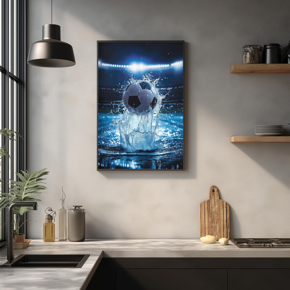 a framed photograph of a soccer ball in mid-air, surrounded by splashing water, mounted on a wall above a kitchen counter.