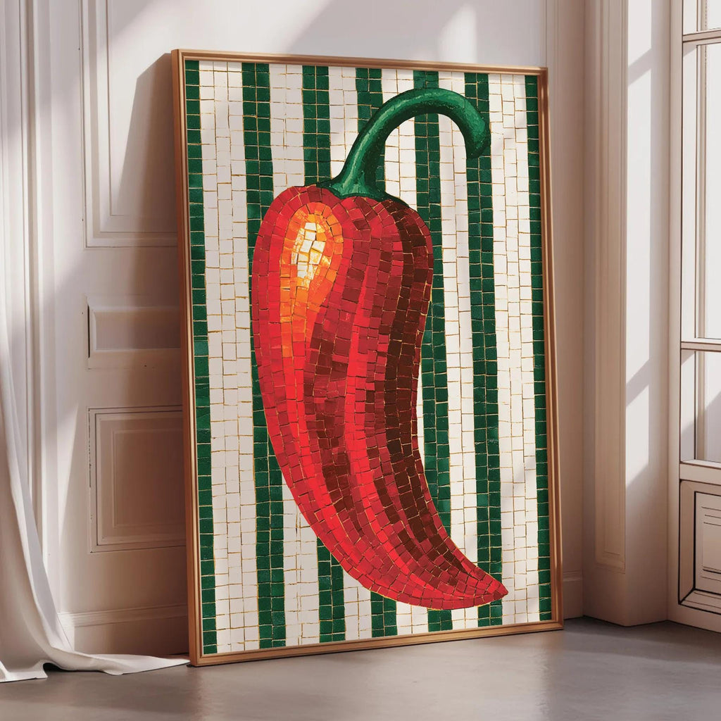 A framed mosaic artwork depicting a red pepper is displayed on a wall in a room with a window.