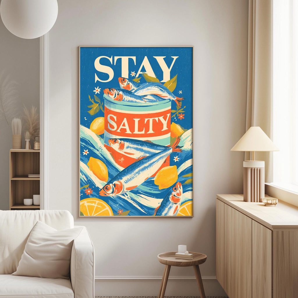 a large framed poster with a vibrant design of fish and citrus fruits, including lemons and limes, along with the text "STAY SALTY".