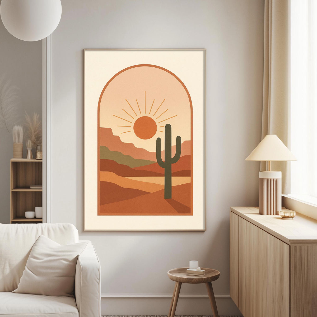 a living room with a large framed print of a desert landscape hanging on the wall, depicting a cactus and a sun-filled sky.