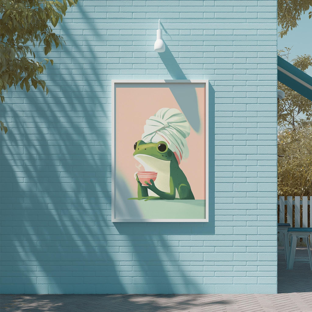 A framed illustration of a green frog wearing a white towel and holding a bowl of food, set against a blue brick wall.