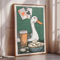 a framed illustration of a duck sitting next to a beer glass and a bowl of chips, with playing cards and a deck of cards displayed above the duck.
