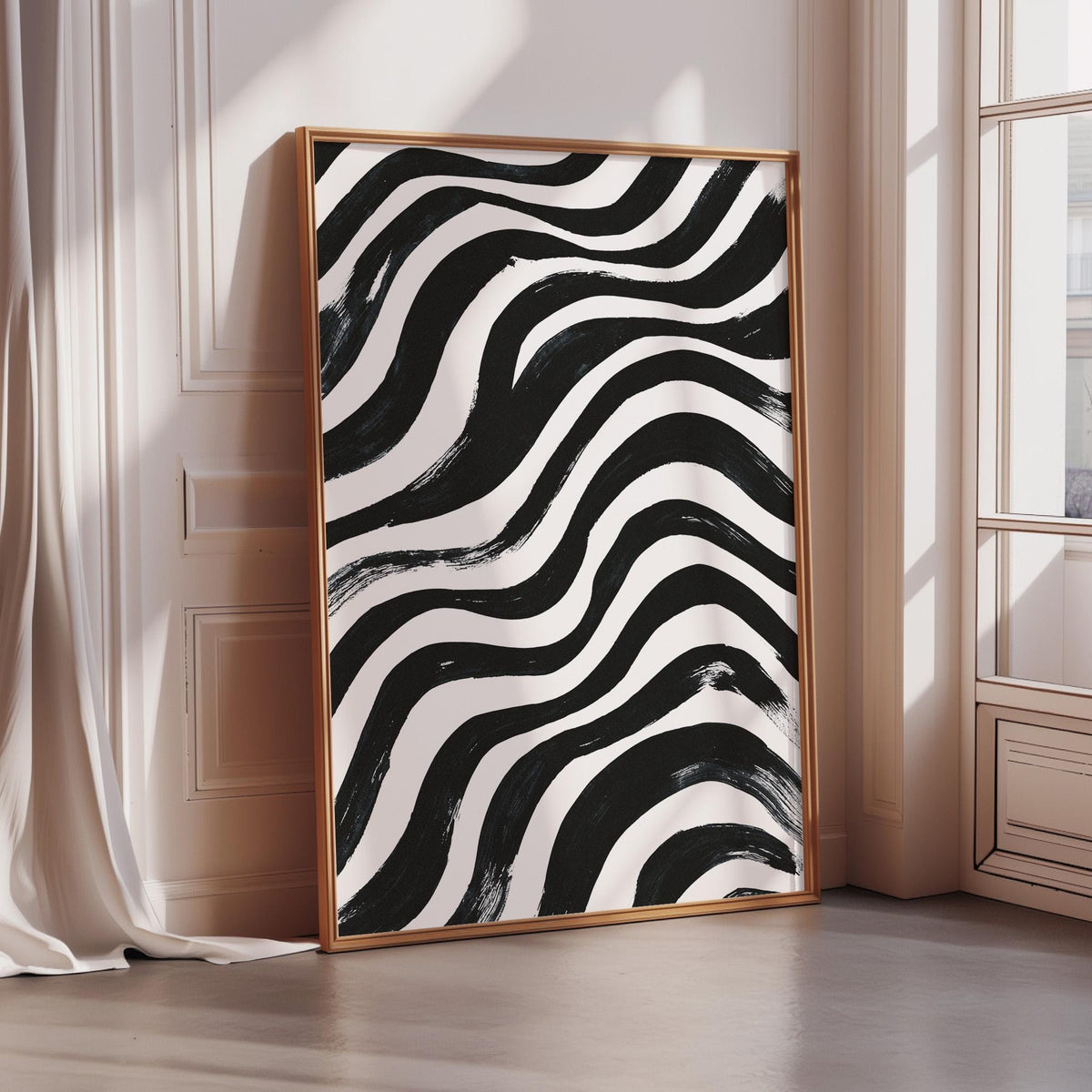 a large, framed artwork with a striking black and white abstract design.