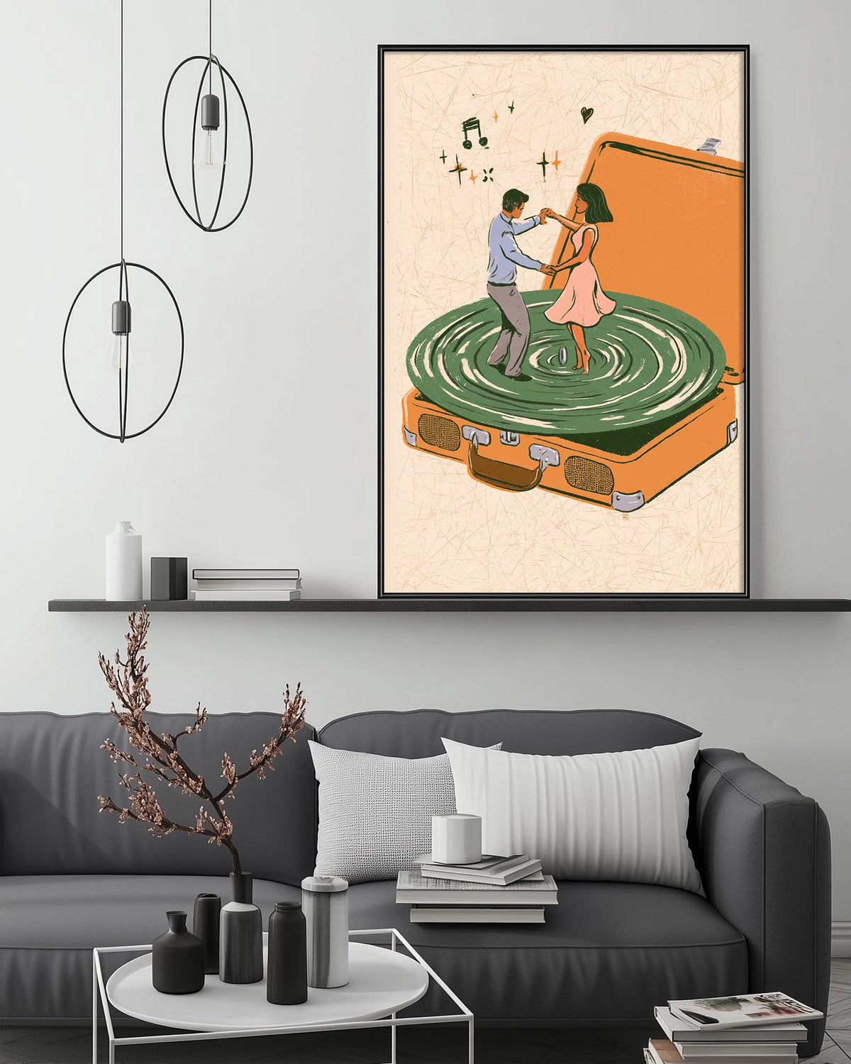 a cozy living room with a gray sofa, a coffee table, and a framed illustration of a man and a woman dancing on a record player.