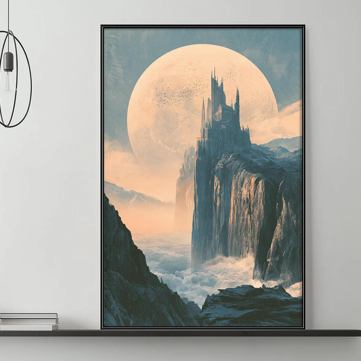 a large, colorful painting of a castle on a cliff, with a large moon in the background. The painting is displayed on a wall above a gray couch, which has a coffee table in front of it. The room has a minimalist and modern design, with a few decorative items and lighting fixtures.