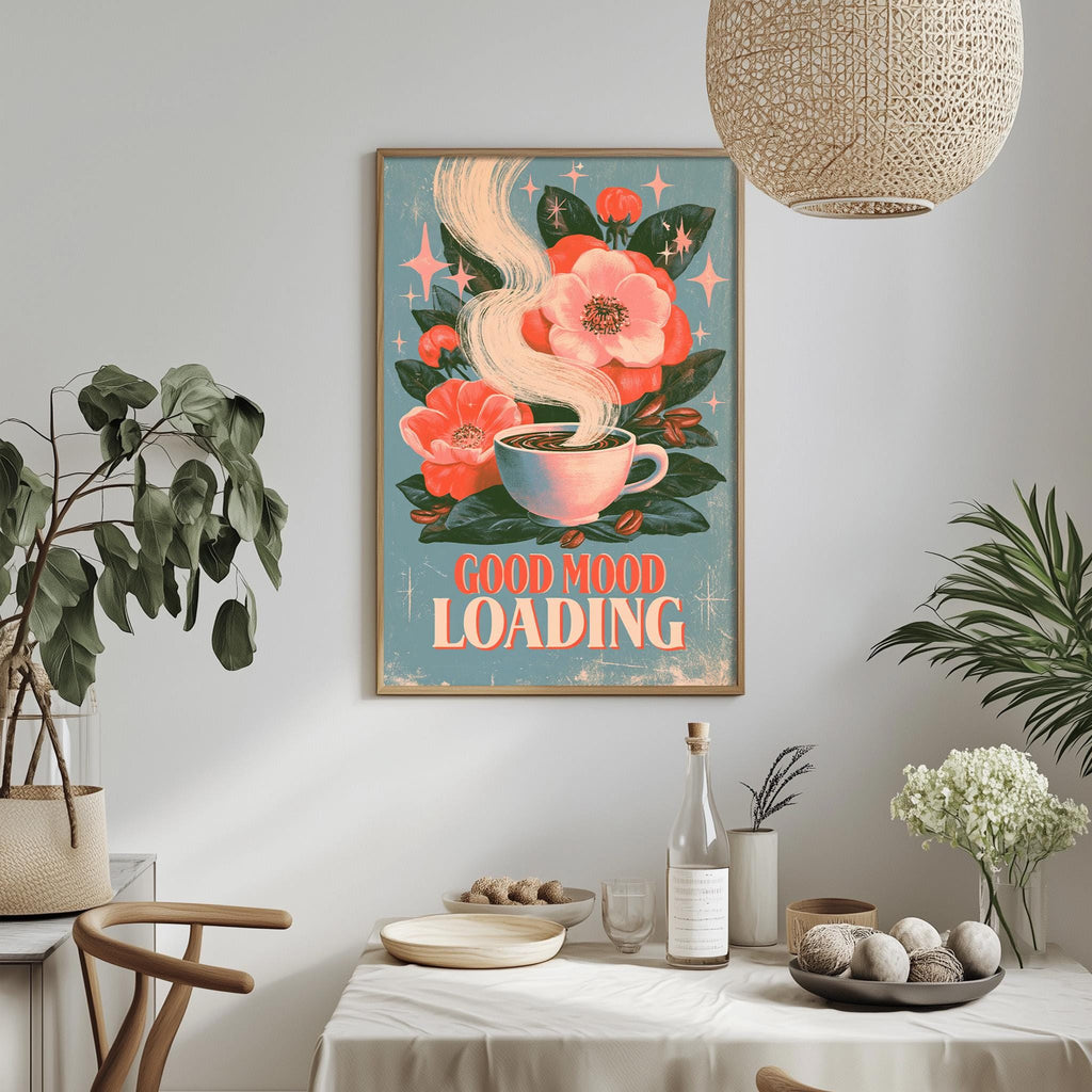 a framed poster with a floral design and the text "GOOD MIND LOADING" hanging on a wall above a dining table with various items on it.