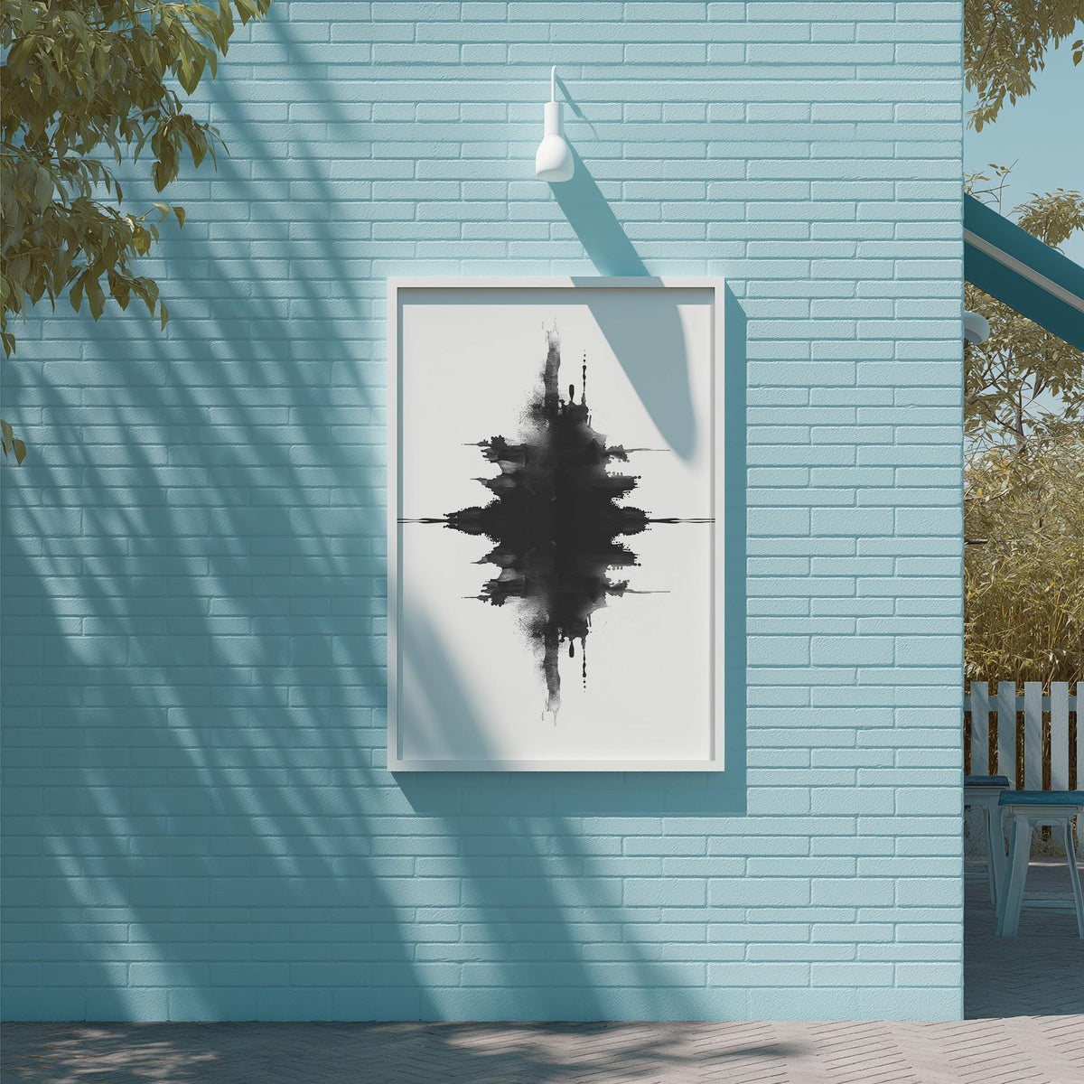a blue brick wall with a framed black and white abstract artwork hanging on it.