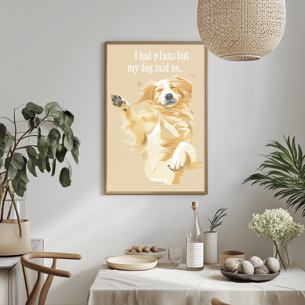 a framed illustration of a dog with a caption that reads "I had plans but my dog said no." The setting appears to be a dining area with a table, chairs, and various decorative elements such as potted plants and vases.