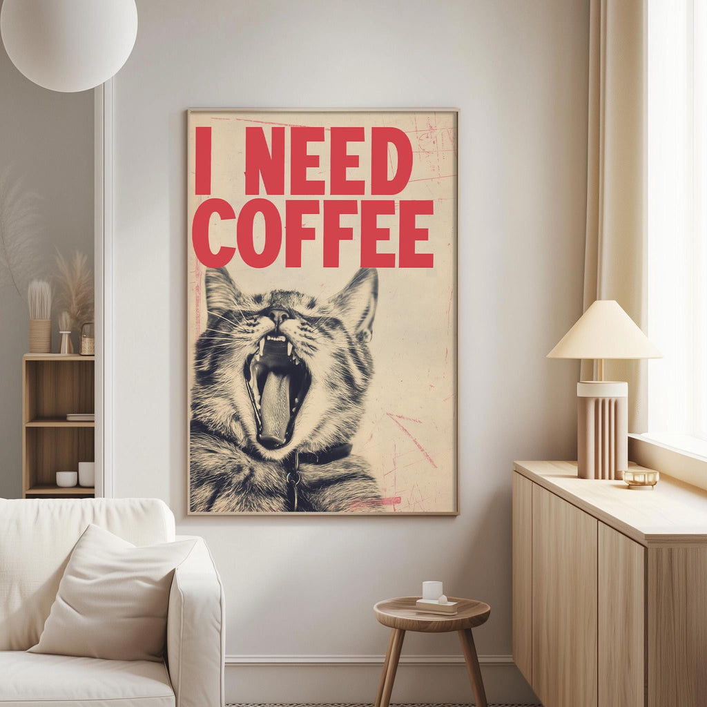 a poster with a cat's face and the text "I NEED COFFEE" in bold red letters.