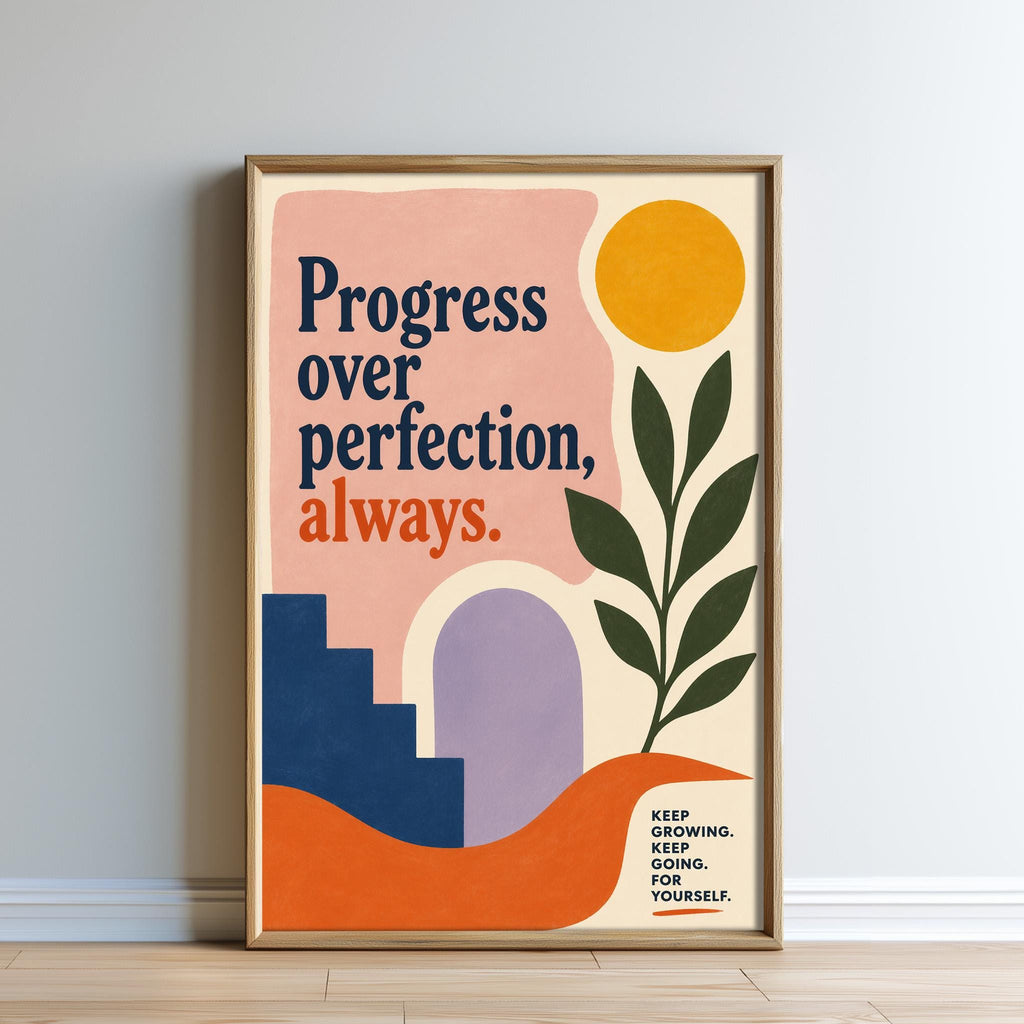 The image is a framed poster with a colorful abstract design and text that reads "Progress over perfection, always."