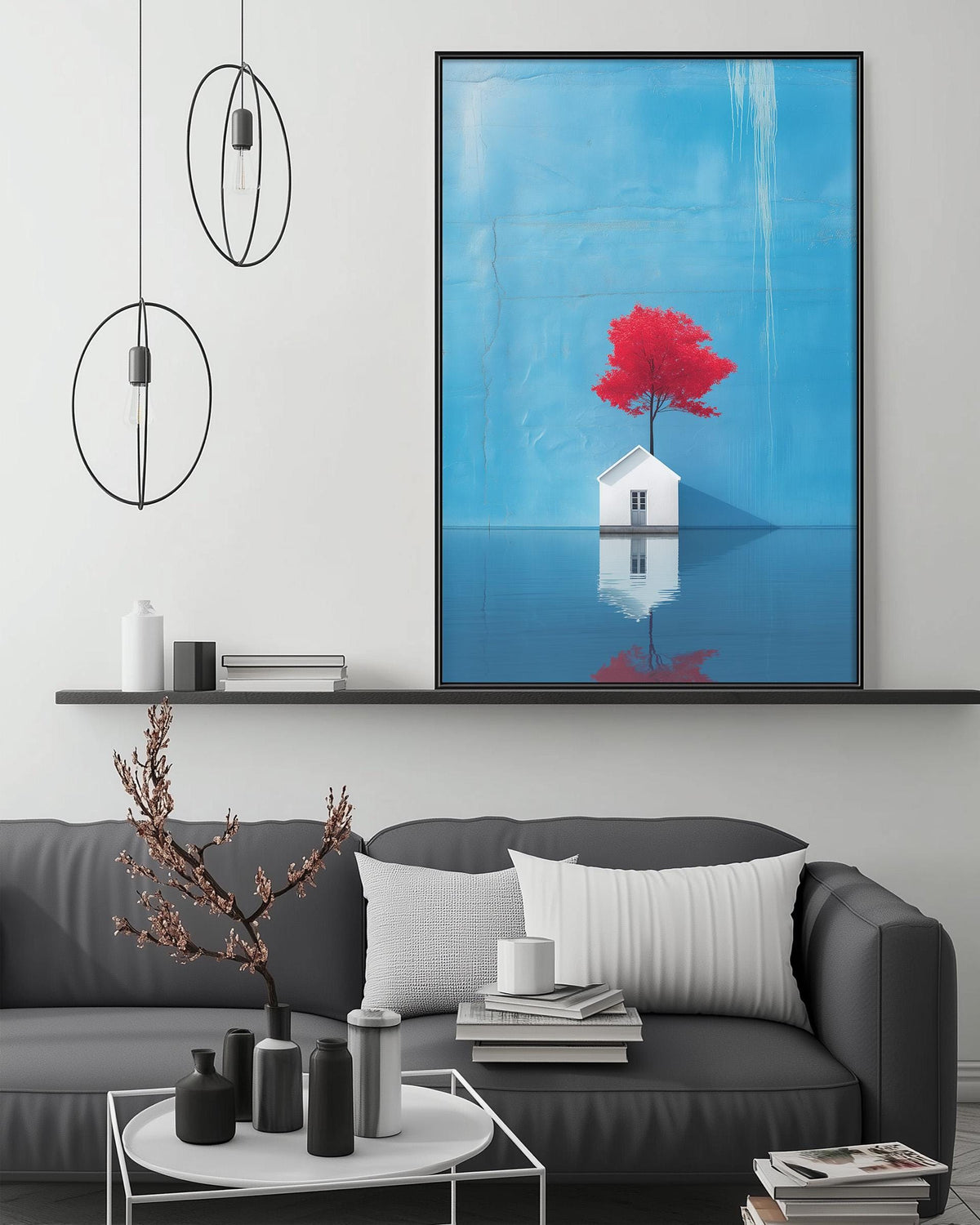 a modern living room with a gray sofa, a coffee table, and a large framed artwork depicting a red tree on a blue background.