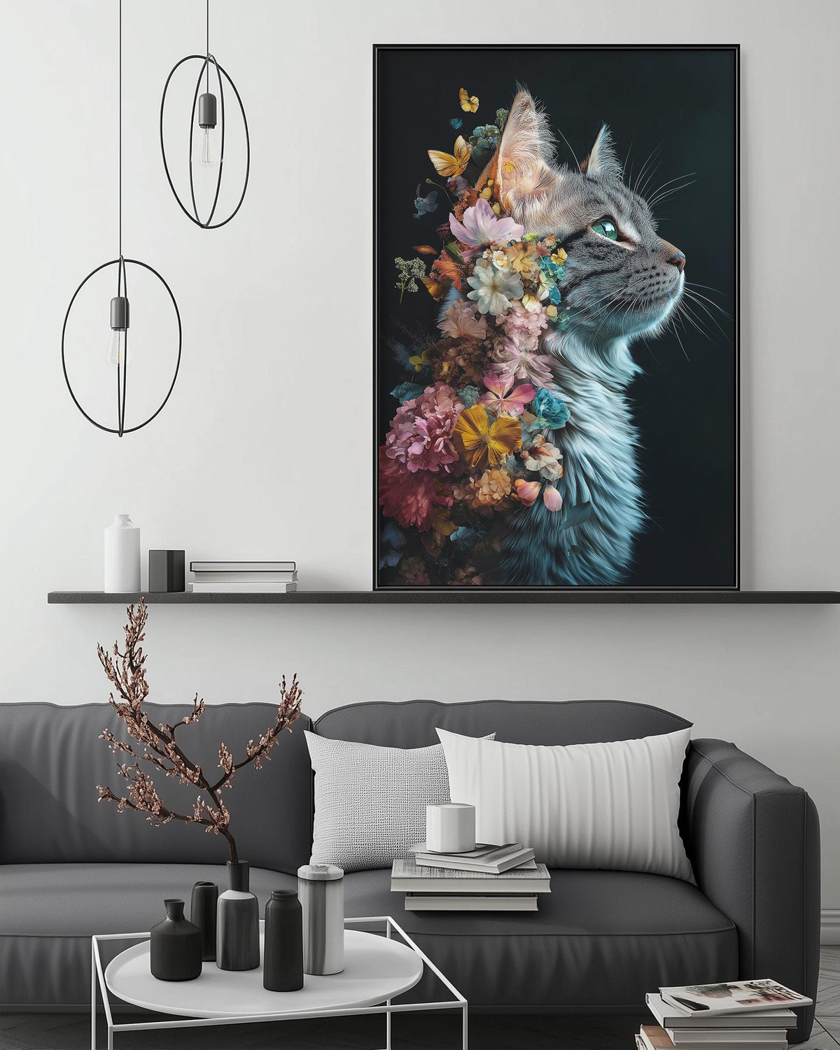 a large framed artwork of a cat with a floral design on its face, displayed on a wall above a gray couch in a living room setting.