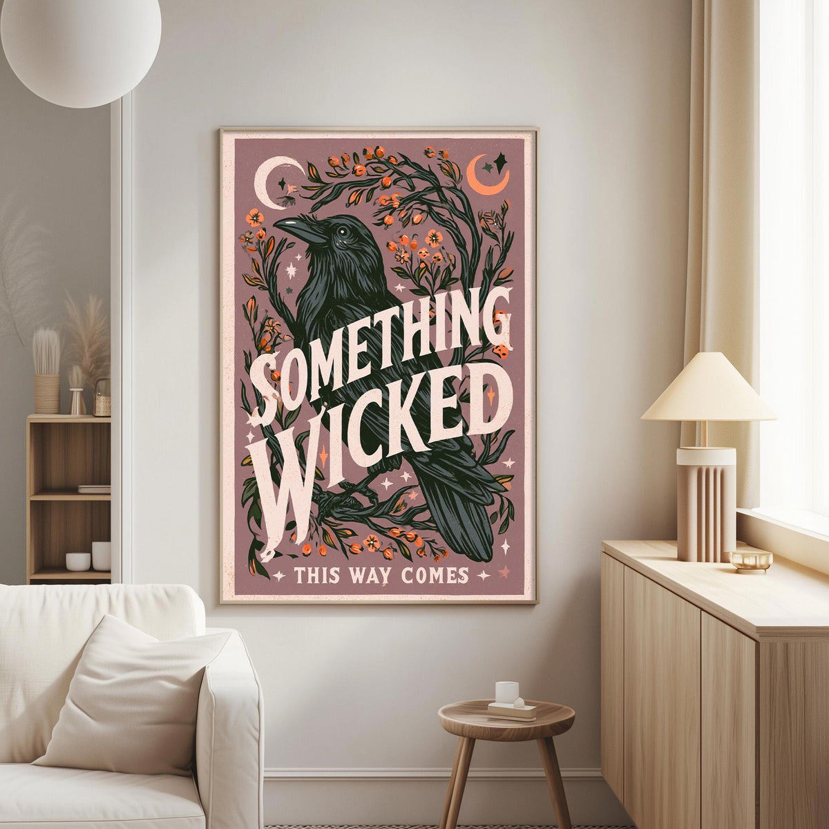 a poster with a black bird and a crescent moon on a pink background, along with the text "Something Wicked This Way Comes" and "This way comes" below the bird.