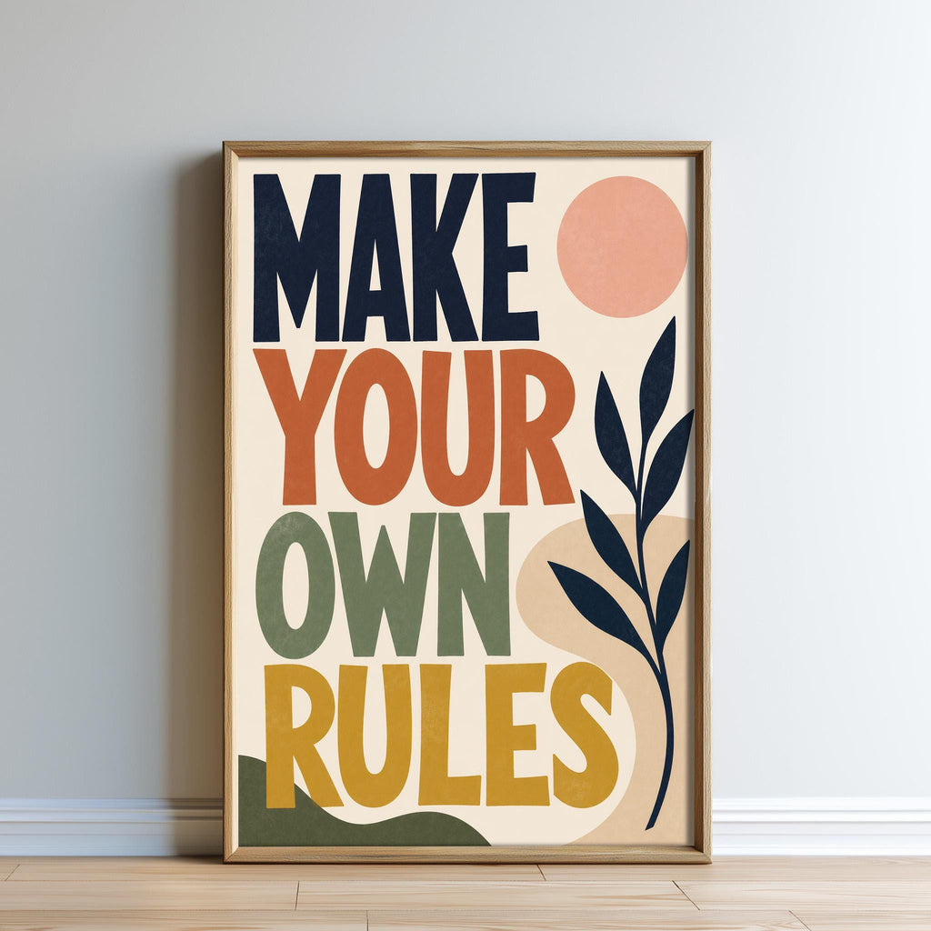 The image is a framed poster with the text "MAKE YOUR OWN RULES" displayed prominently.
