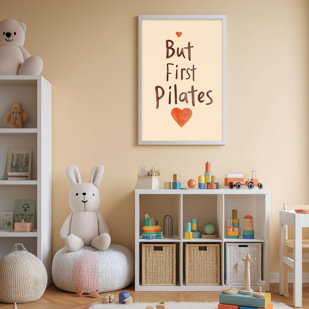 A cozy children's room with a stuffed rabbit, a shelf with toys, and a framed poster with the text "But First Pilates" and a heart symbol.
