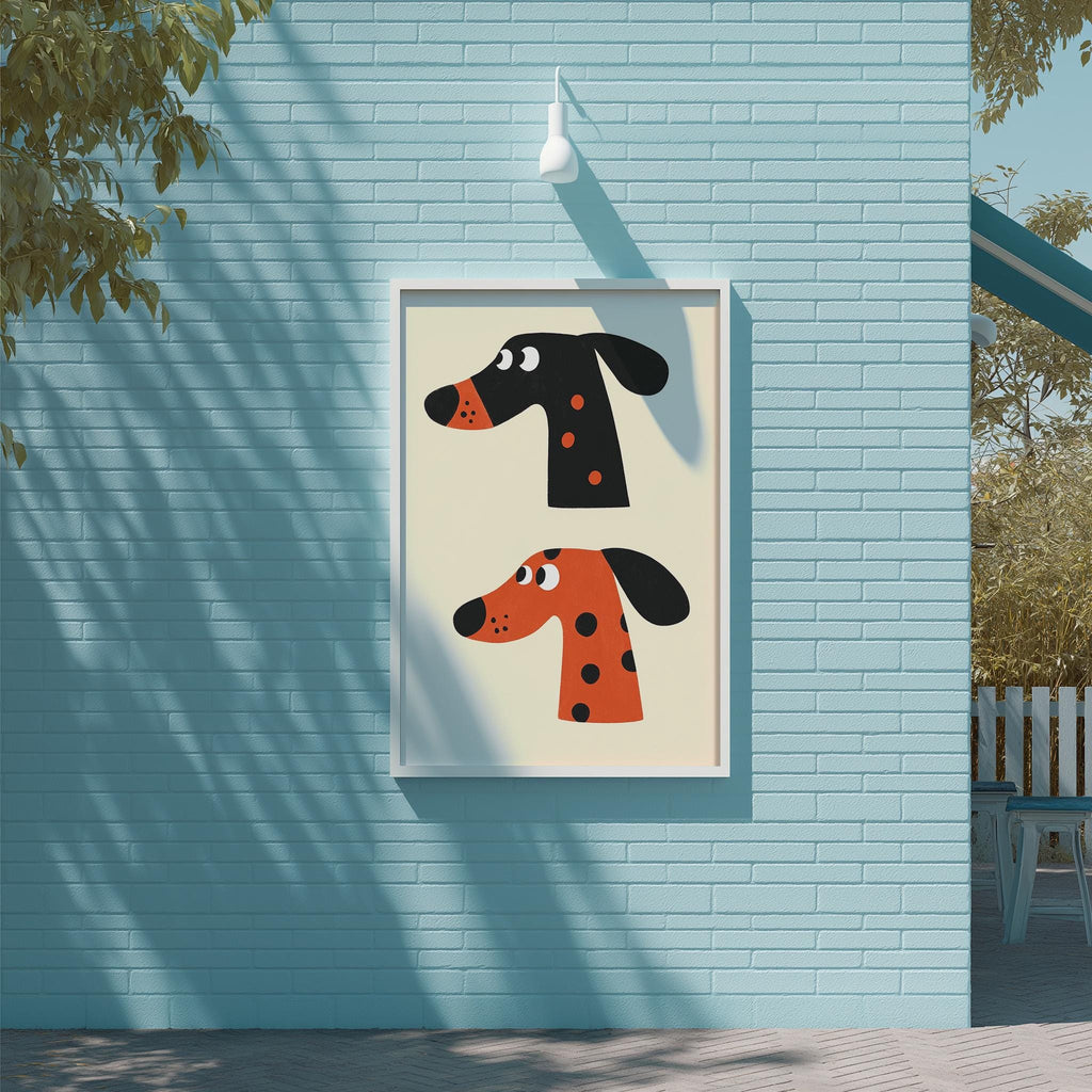 a blue brick wall with a framed illustration of two cartoon dog heads, one black and one orange, hanging on it.