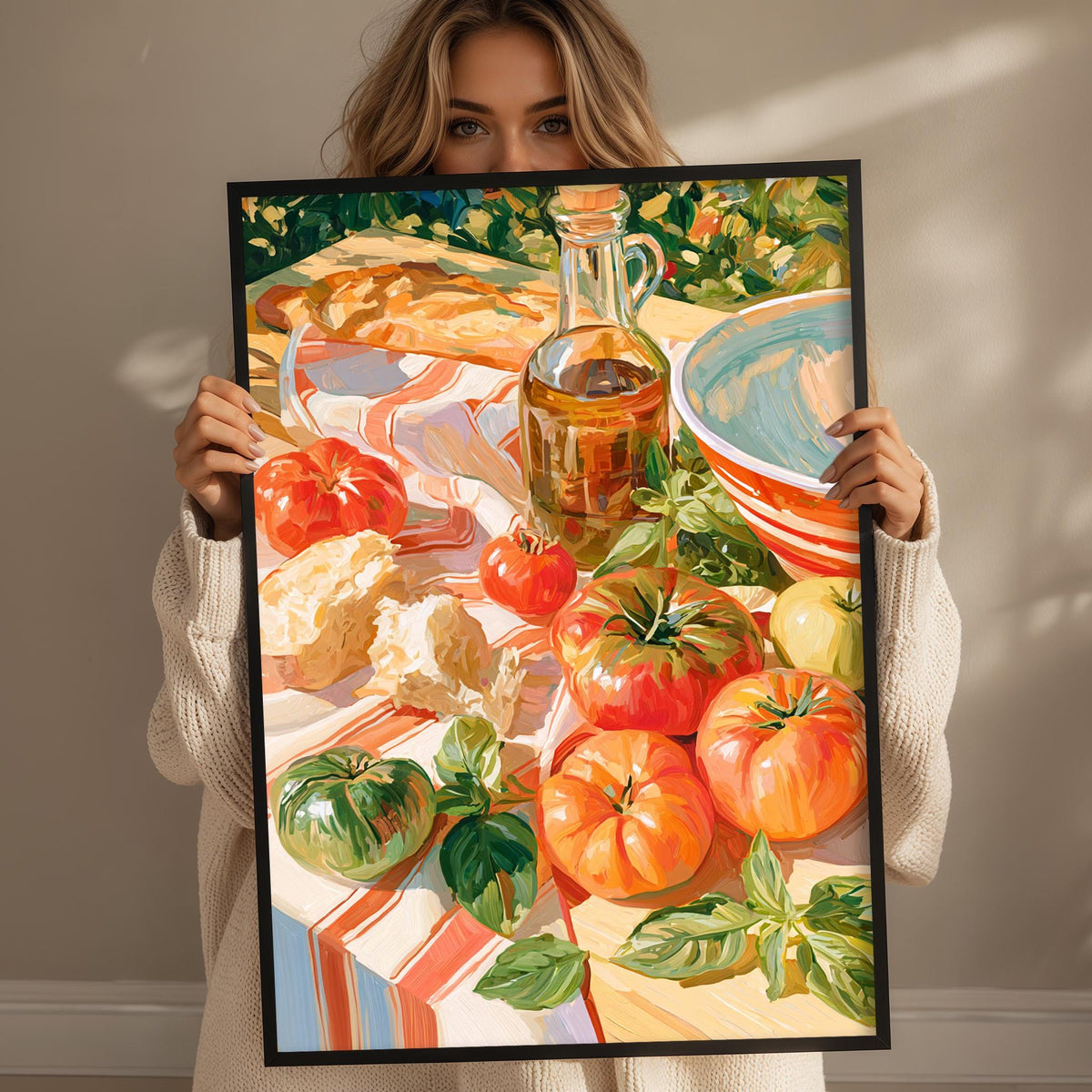 A woman holds up a framed painting depicting a table with various food items, including tomatoes, bread, and a bowl.
