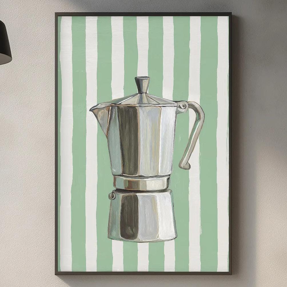 a kitchen counter with various kitchen items, including a coffee maker, a cutting board, and some decorative elements.