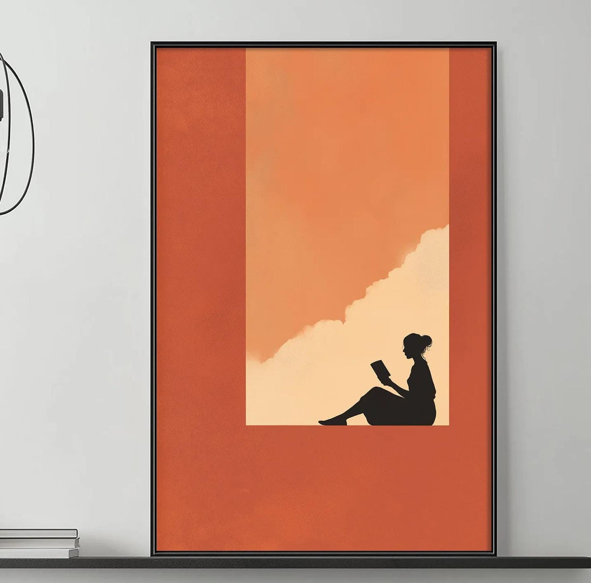 a modern living room with a gray sofa, a coffee table, and a large orange and black abstract painting hanging on the wall above the sofa.