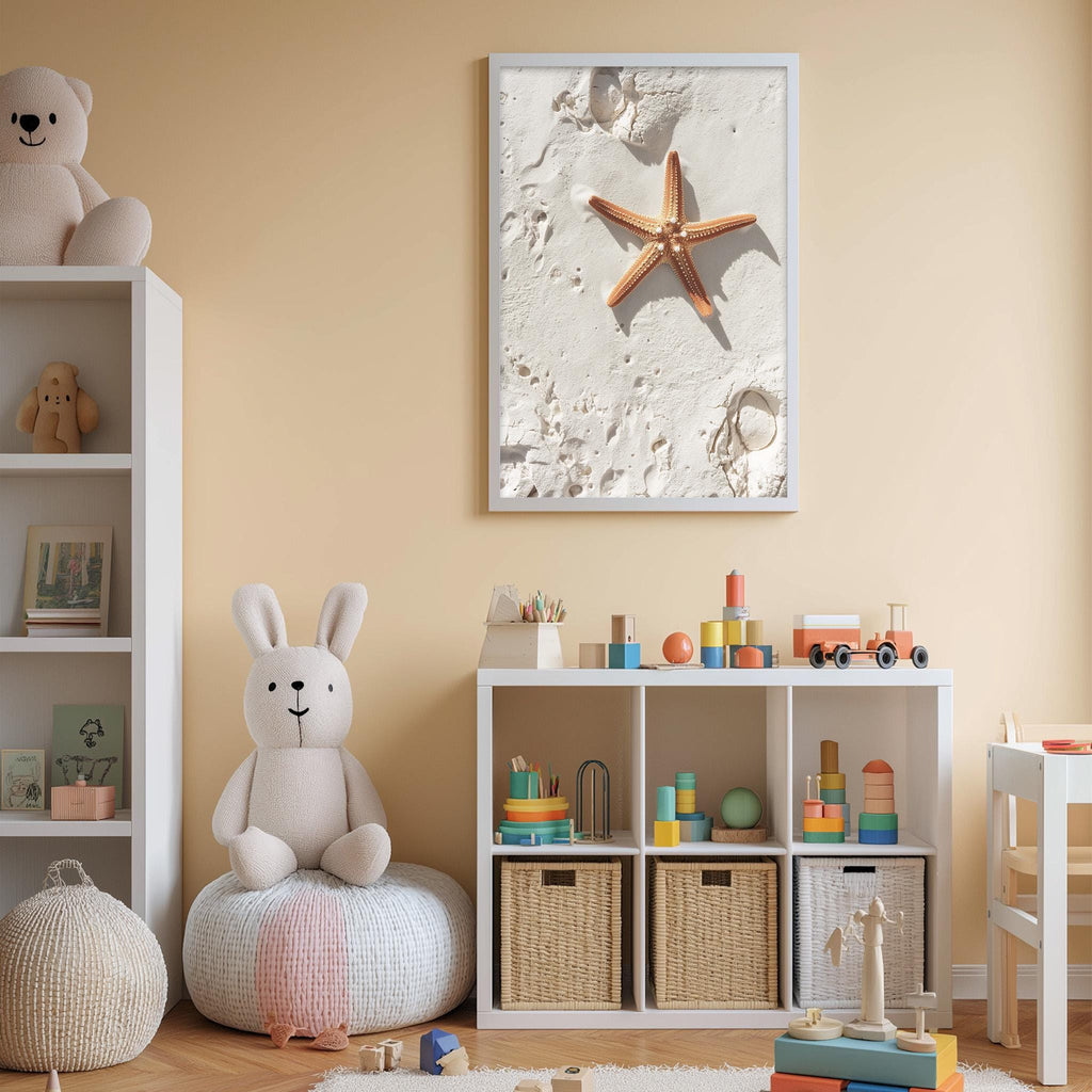 A cozy children's bedroom with a white bookshelf, a plush bunny, and a toy train set. The walls are painted a light peach color, and a framed picture of a starfish on the wall adds a beachy touch to the room.
