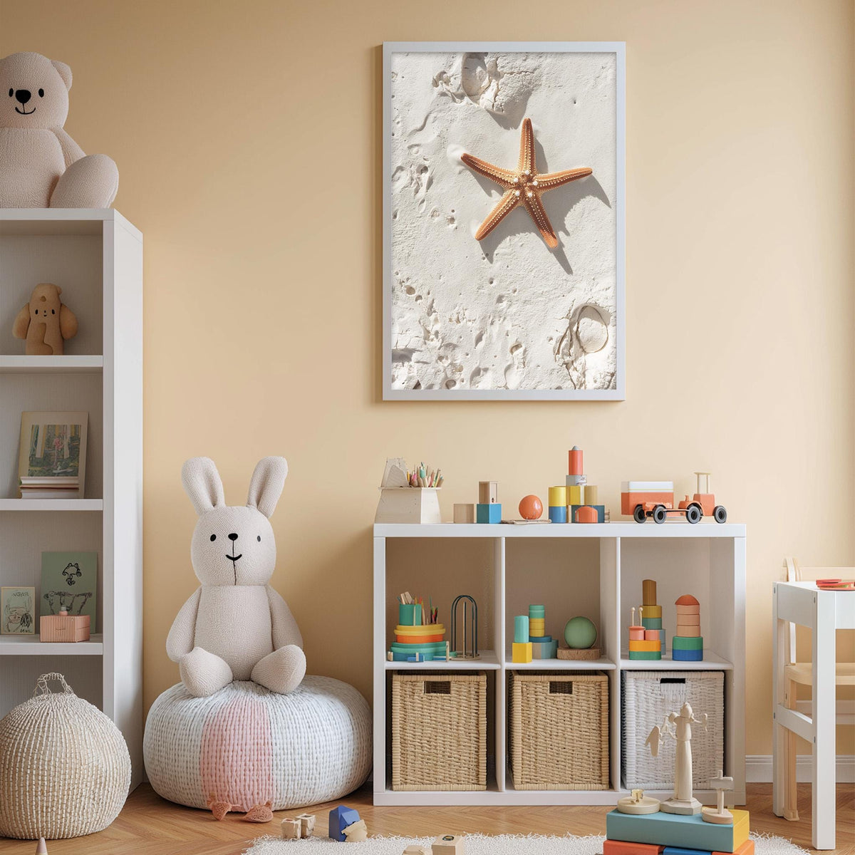 A cozy children's bedroom with a white bookshelf, a plush bunny, and a toy train set. The walls are painted a light peach color, and a framed picture of a starfish on the wall adds a beachy touch to the room.