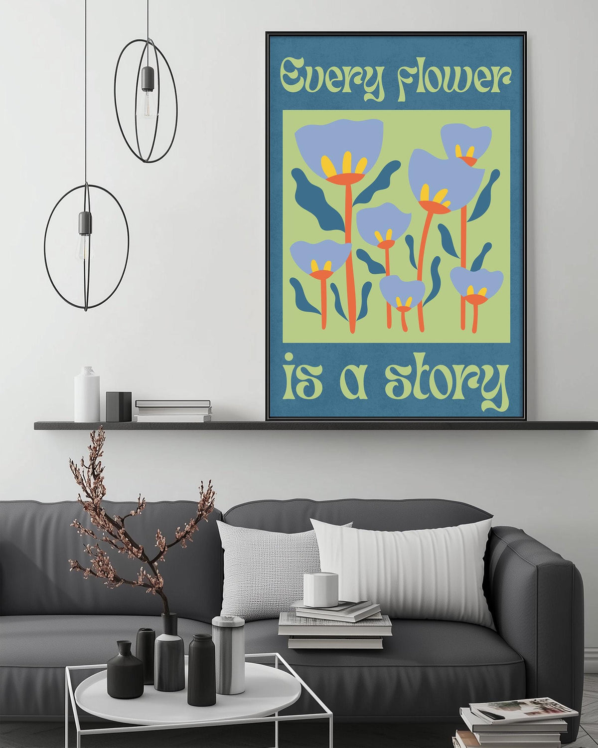 a cozy living room with a gray couch, a coffee table, and a framed poster with a floral design hanging on the wall above the couch.