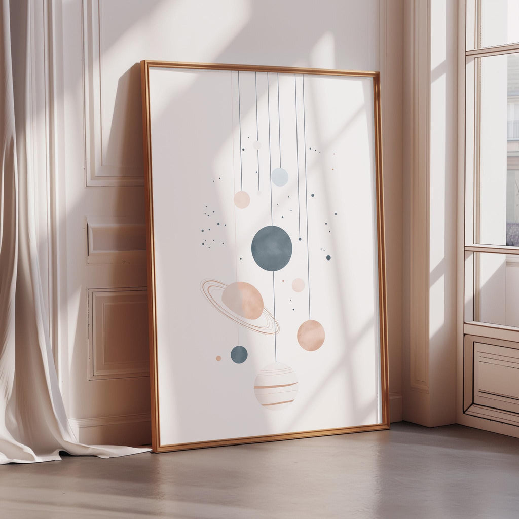 a large framed poster with a space-themed illustration, including planets and stars, hanging on a wall.