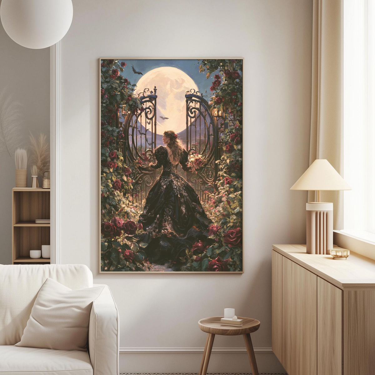 a large painting of a woman in a black dress standing in front of a gate with a full moon behind it, surrounded by flowers and greenery. The painting is hanging on a wall in a living room setting, with a white sofa and a wooden side table nearby.