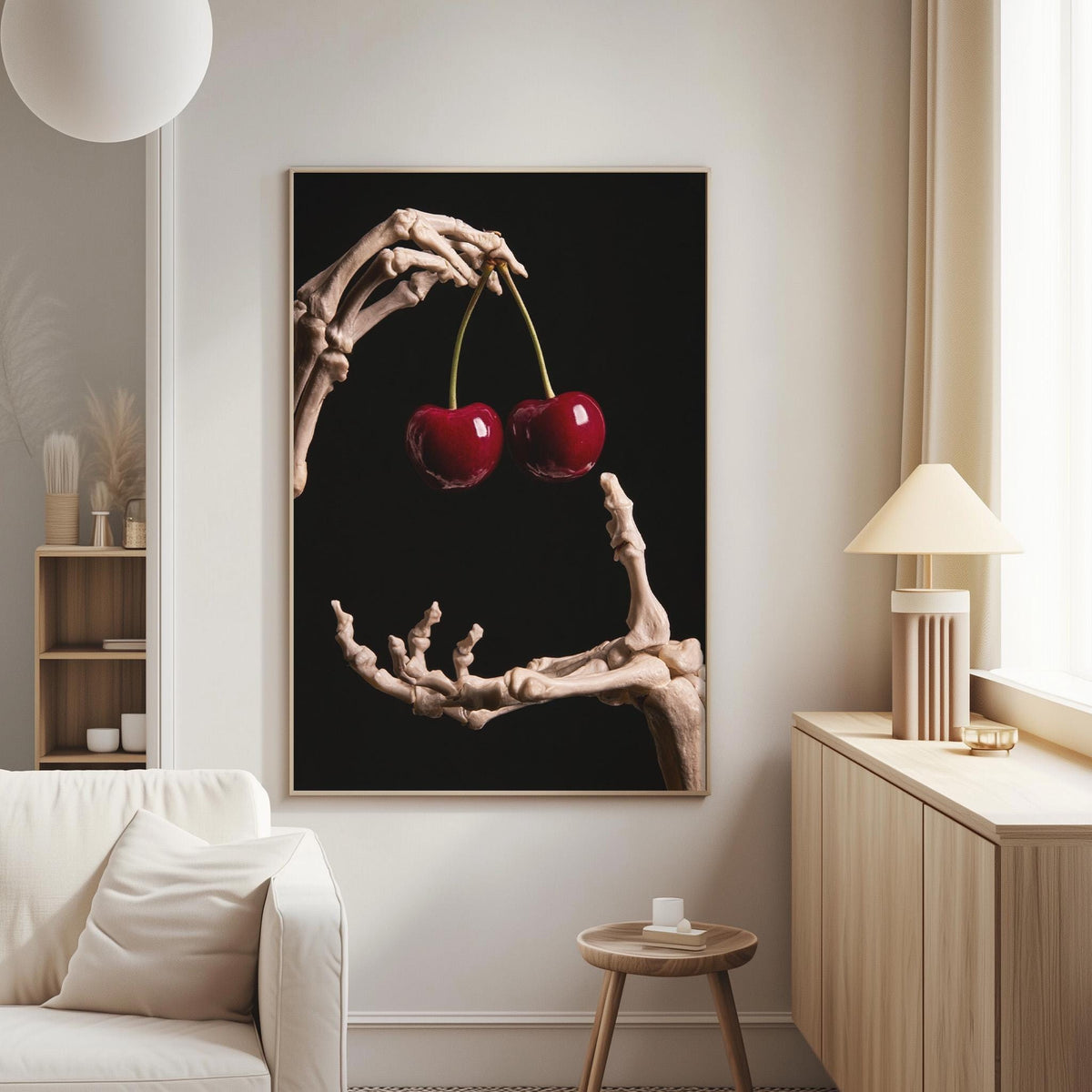 a skeleton hand holding two cherries, creating a striking and surreal visual.