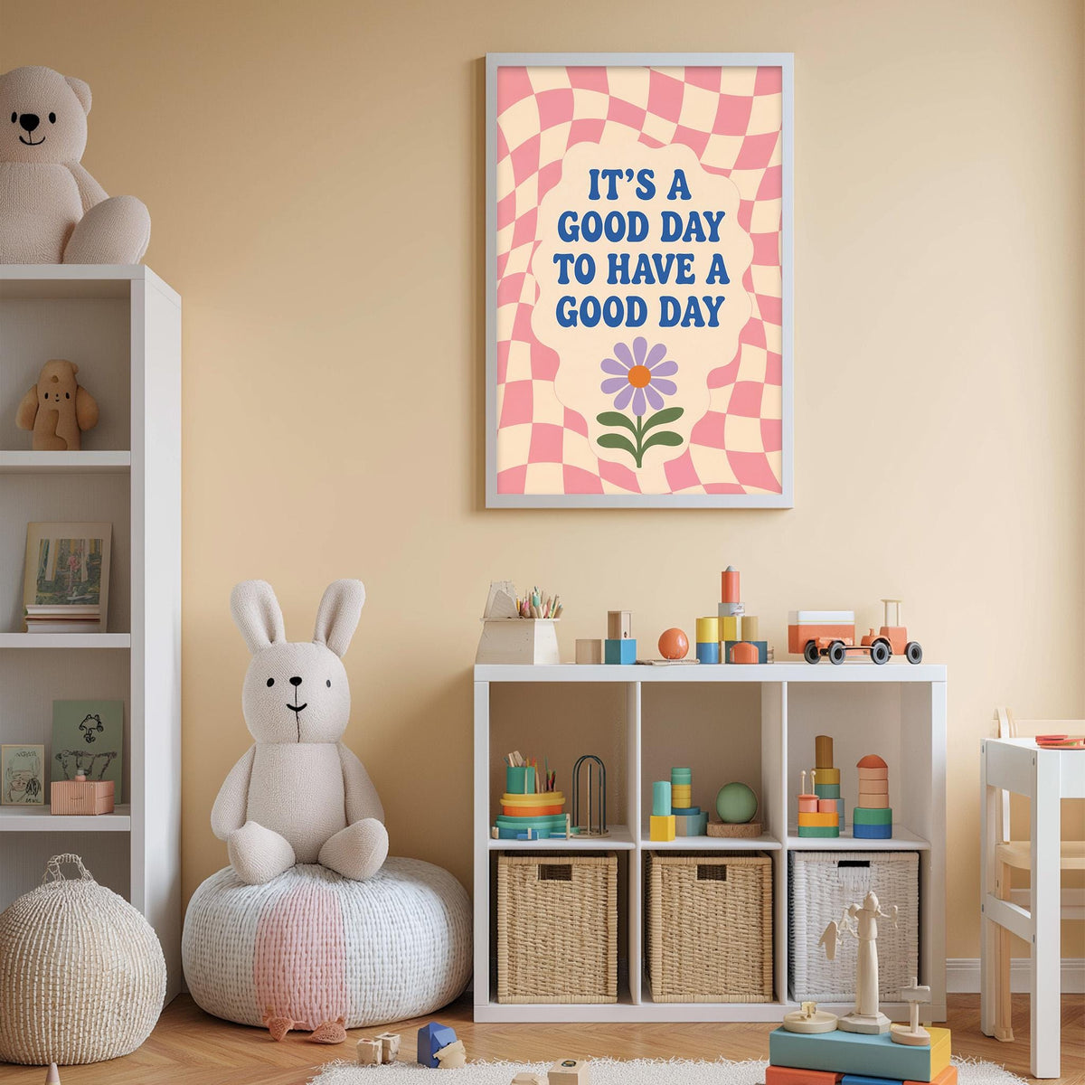 A child's bedroom with a checkered wall, a stuffed rabbit, a toy train, and a framed poster with the text "It's a good day to have a good day".