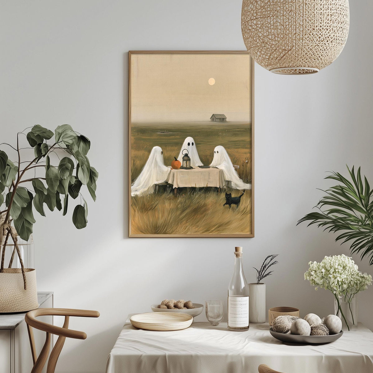 a cozy dining scene with a table set for three, featuring a tablecloth, plates, bowls, and a bottle of wine. Three ghostly figures are seated at the table, adding a whimsical touch to the scene. The table is adorned with potted plants and other decorative items, creating a warm and inviting atmosphere.