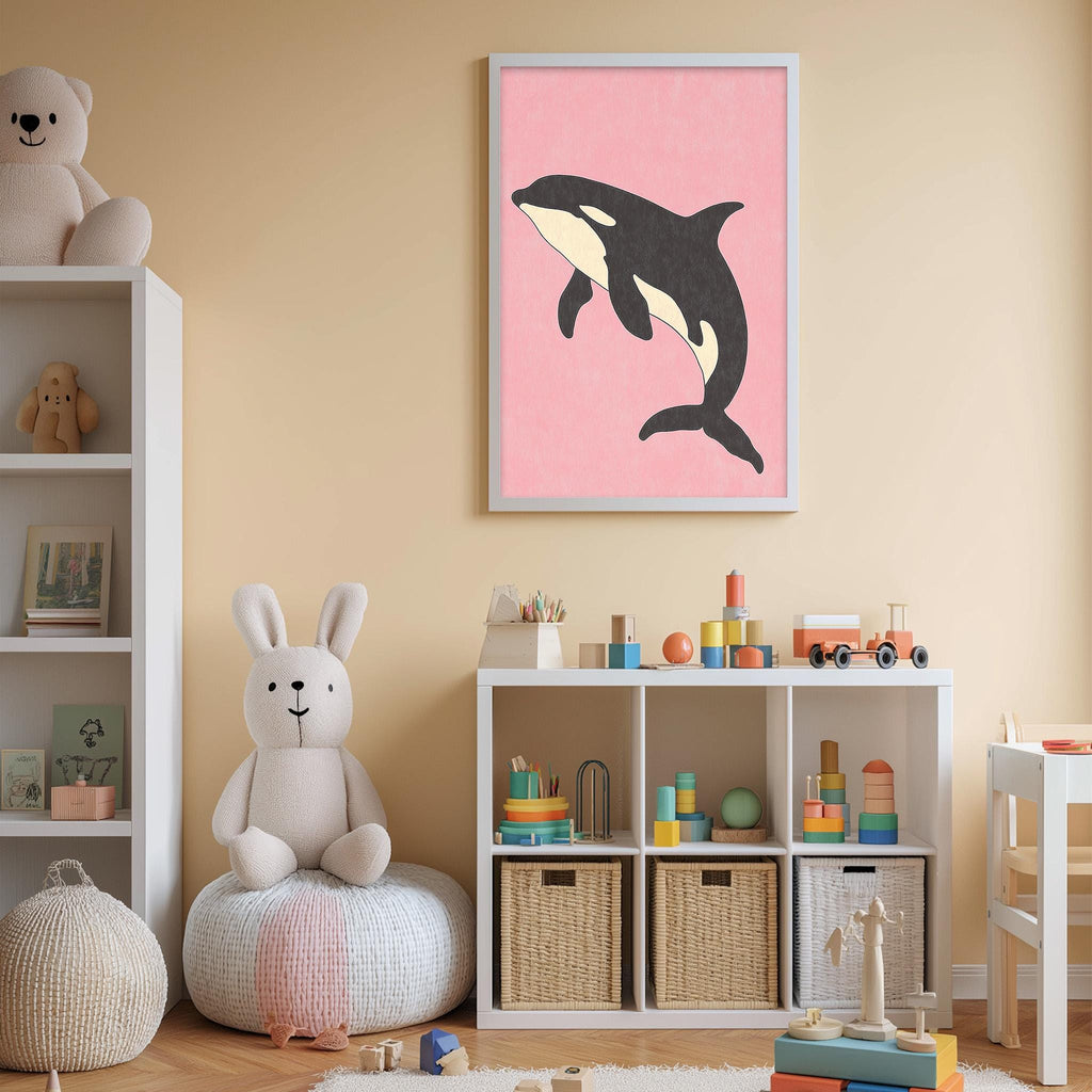 A child's bedroom with a pink wall, a framed picture of a whale, a stuffed rabbit, a toy shelf with toys, and a basket.