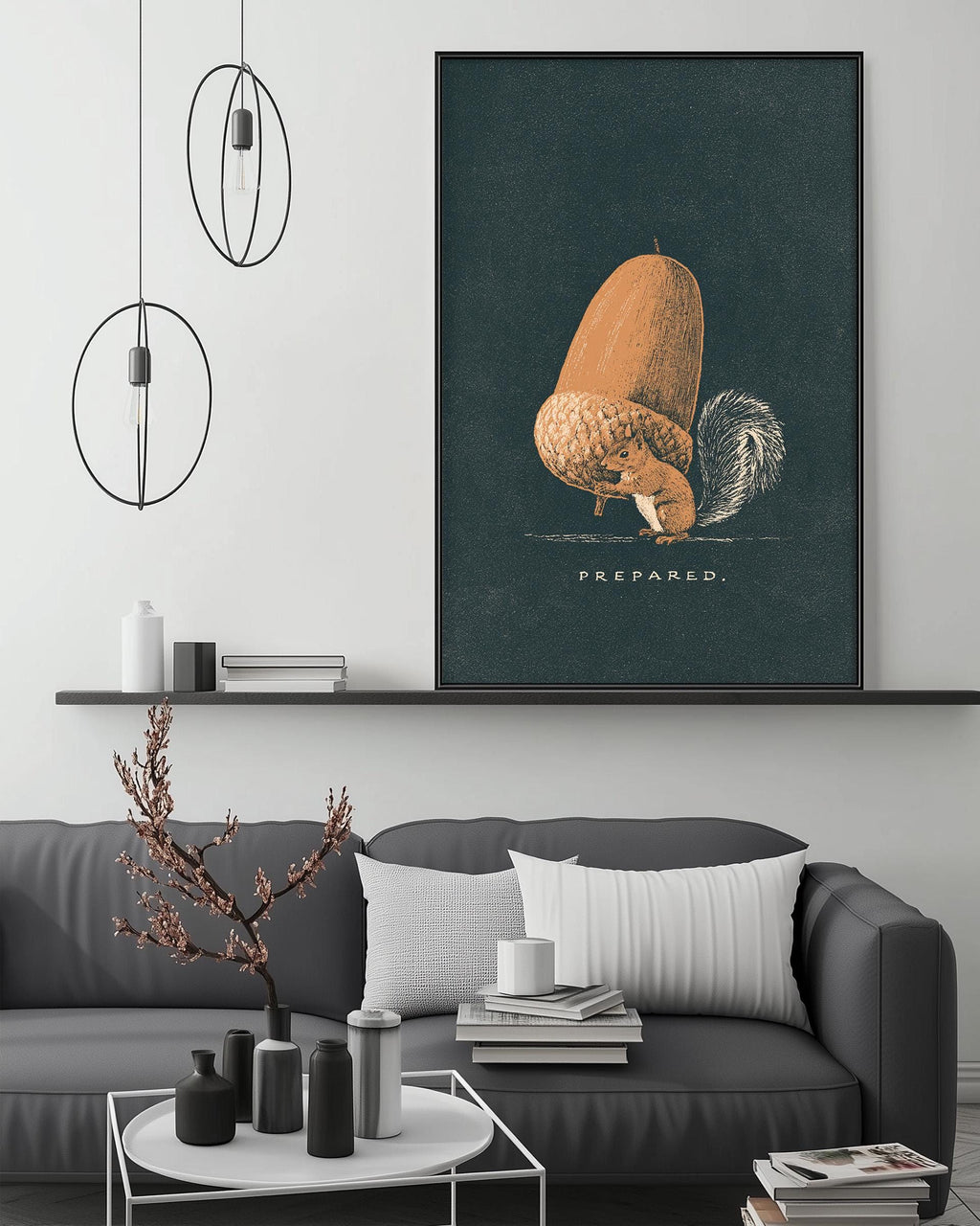 a cozy living room with a gray sofa, a coffee table, and a large framed print of an acorn on the wall.