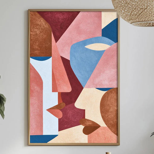 a modern art piece hanging on a white wall above a dining table with various decorative items and plants.