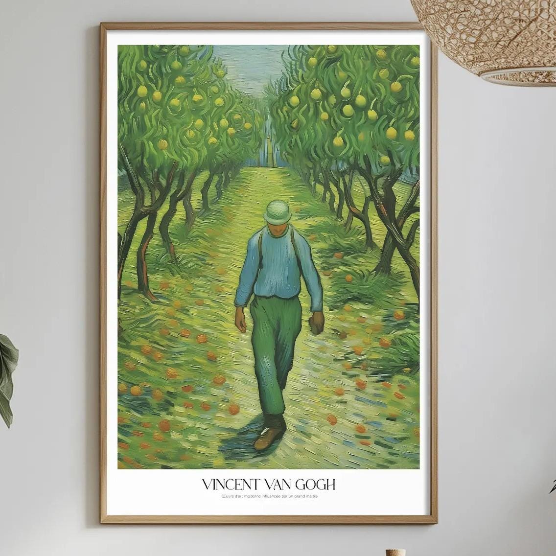 a framed painting of a man walking through a lush, green landscape, with a bottle of wine and other decorative items on a table in the foreground.