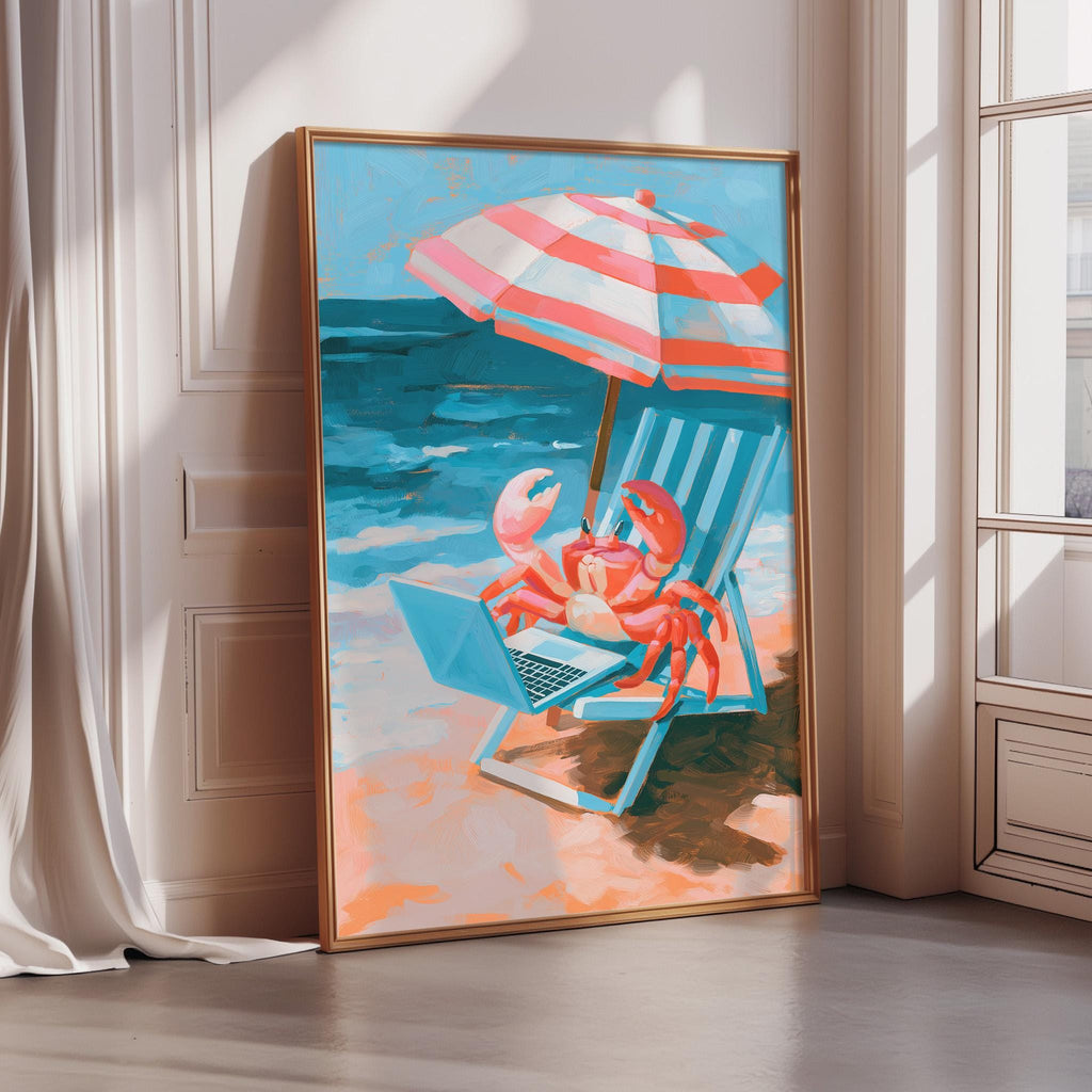 A framed painting depicting a crab sitting in a beach chair under an umbrella, with a laptop on the chair's surface.