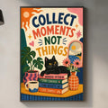 a colorful poster with the text "Collect moments, not things" hanging on a wall above a kitchen counter.
