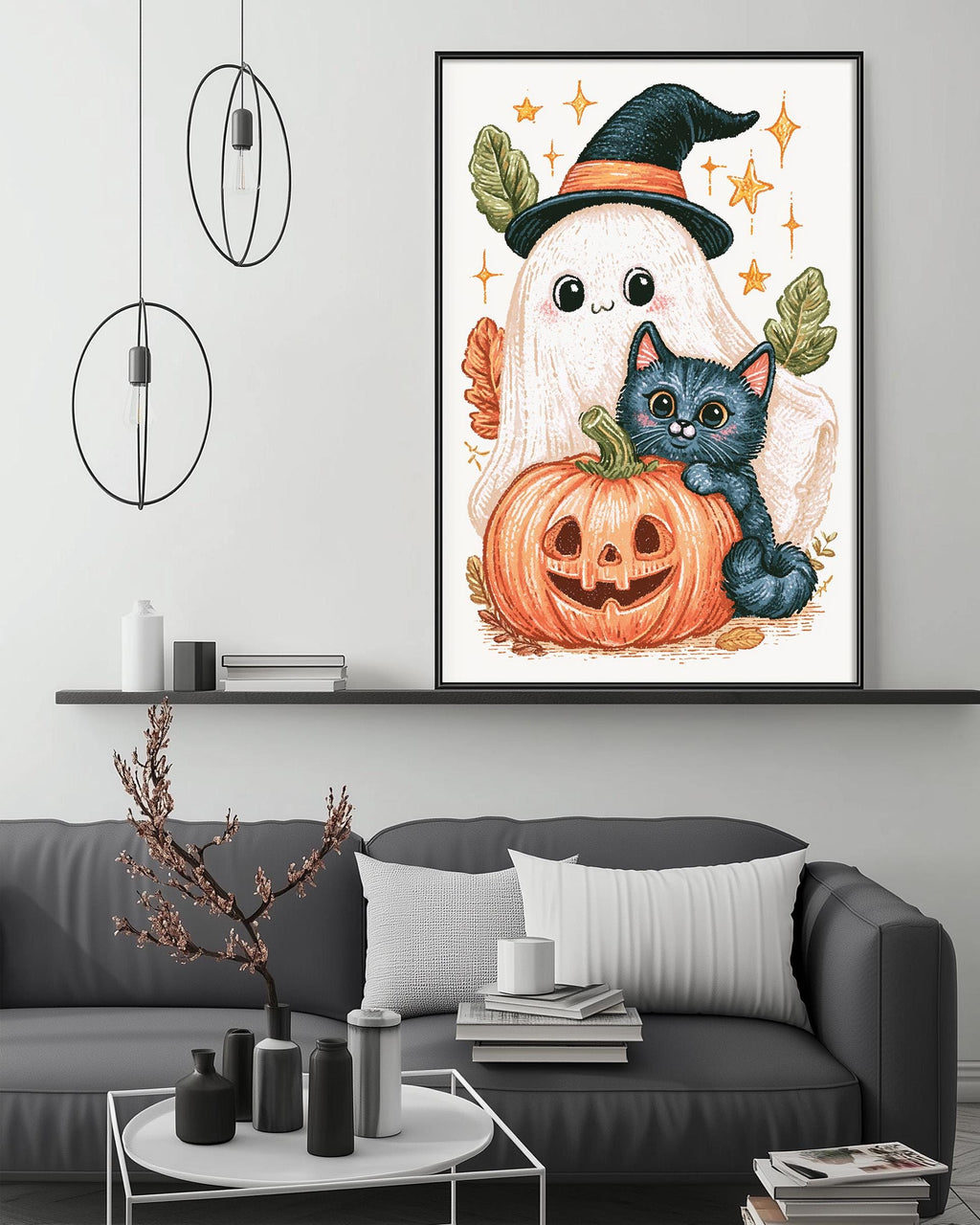 a cozy living room with a gray couch, a coffee table, and a framed illustration of a witch, cat, and pumpkin on the wall.