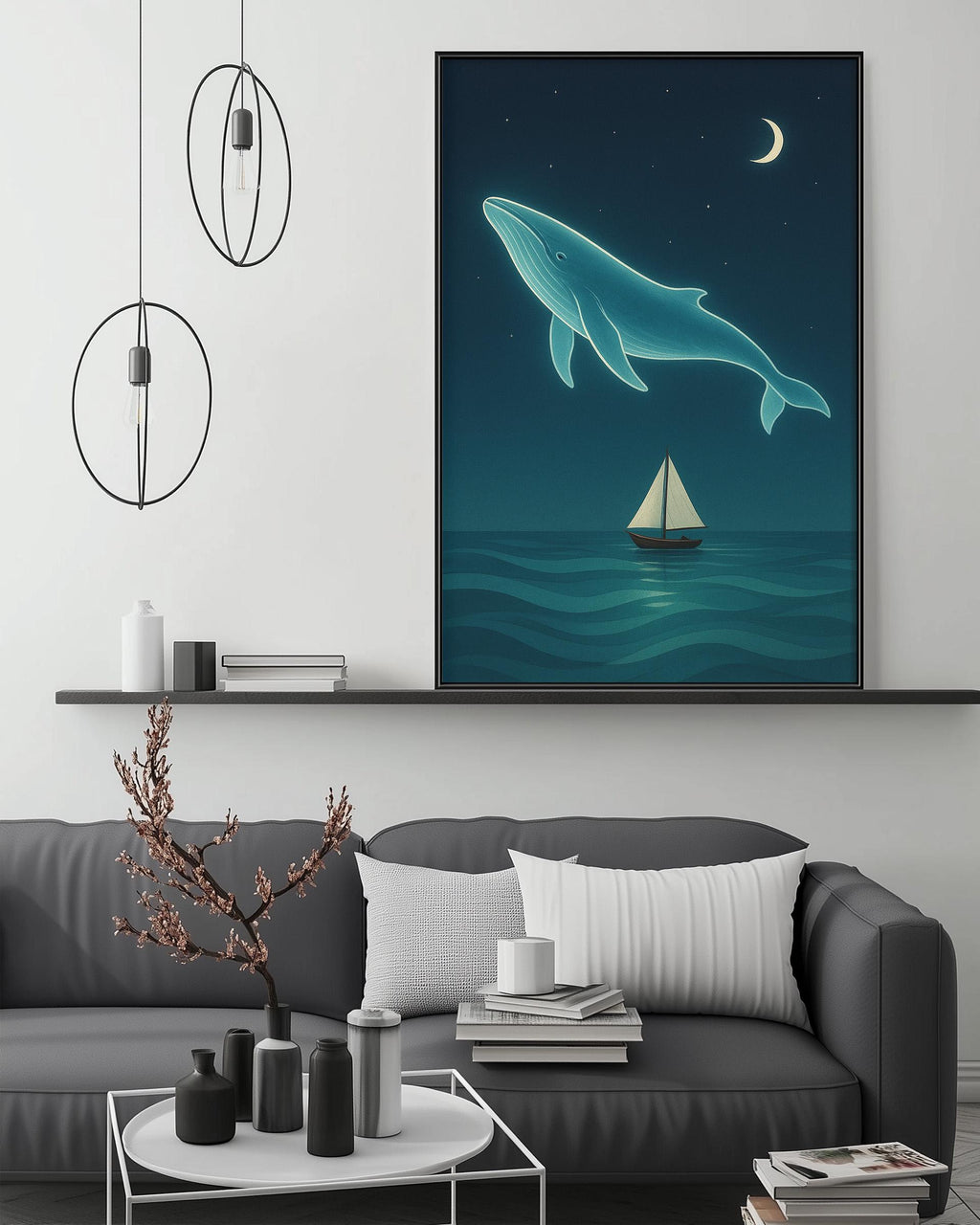 a large painting of a whale swimming in the ocean, with a sailboat in the background, all set against a night sky with a crescent moon. The painting is displayed on a wall above a gray couch, which has a coffee table in front of it. The room also includes a shelf with various decorative items, and a pendant light fixture hanging above the couch.