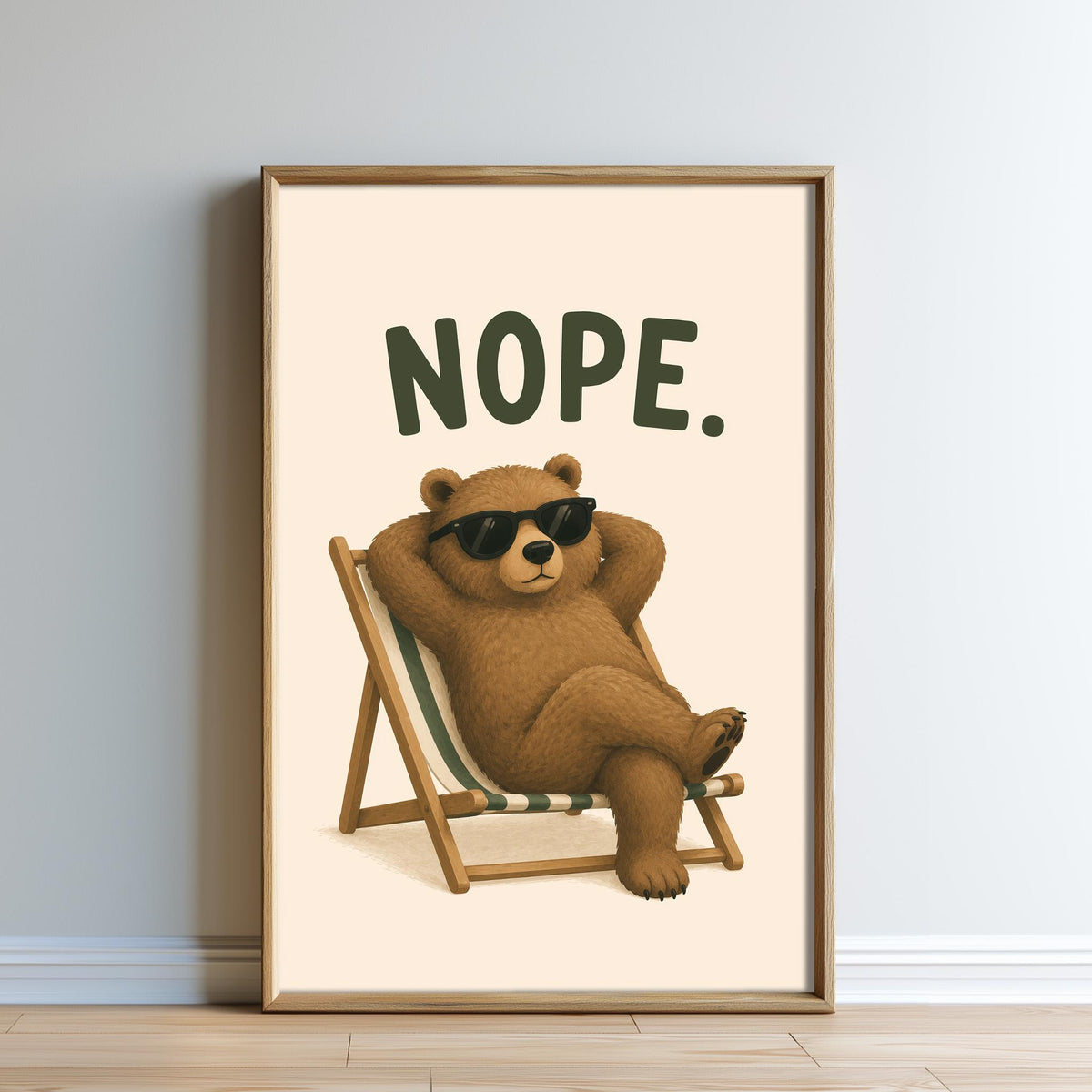 A framed illustration of a bear wearing sunglasses and reclining in a chair with the text "NOPE."